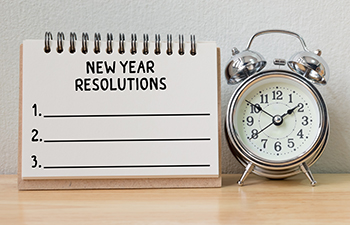 New Year. New Leads. New Year Resolutions list with clock.